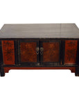 Black lacquer wood cabinet with red floral panels and two central metal handles, antique Chinese style.