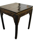 Black lacquer wood altar table with carved floral patterns and curved legs, antique style.