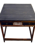 Black lacquered square Chinese table with two drawers, bamboo-style legs, and decorative cut-out front detailing.
