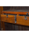 Brown lacquered wood cabinet with two drawers and metal locks, antique style, shown indoors for storage use.