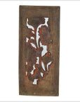 Brown wood rectangular panel with carved floral pattern, cutouts, and weathered vintage finish, close-up view.
