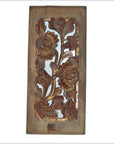 Brown wooden panel with intricate floral carvings, antique Chinese style, rustic and weathered, close-up view.