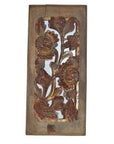 Brown wooden panel with intricate floral carvings, antique Chinese style, rustic and weathered, close-up view.