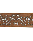 Brown teak wood floral lattice panel with abstract cut-out patterns, antique Chinese carving, close-up view.