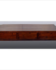 Brown tiger elm wood Chinese coffee table with three drawers, plain background.