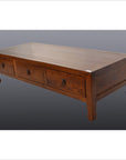 Brown tiger elm antique Chinese coffee table with three drawers, set against a gray gradient background.