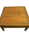 Light brown wood Chinese coffee table with visible wood grain, top view.