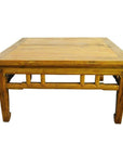 Light brown wood antique Chinese coffee table with rectangular shape and sturdy legs, isolated on white background.