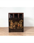 Black lacquer wood Chinese display cabinet with hand painted chinoiserie, three open shelves, against white wall.