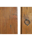 Close-up of brown wood antique Chinese doors with metal ring handle and natural patina, vertical gap visible.