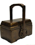 Brown wooden Chinese dowry box with tall ornate handle and carved details, close-up view.