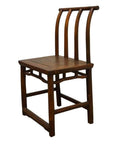 Brown wooden antique Chinese handmade chair with curved back, three vertical slats, and square seat, studio view.