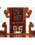Brown wood hand-carved Chinese chair with intricate details and central floral motif, natural wood patina.