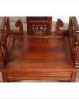 Brown wood antique Chinese chair with carved details and curved armrests, top view, natural wood patina.