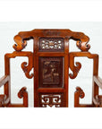 Natural wood antique Chinese hand-carved chair with intricate scrollwork and carvings, on white background.
