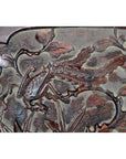 Dark rosewood Chinese wall plaque, hand-carved with stylized bird and foliage, lacquered finish, close-up view.
