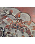 Reddish-brown and gray lacquer rosewood wall plaque with hand-carved floral design, close-up view.