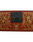 Close-up of red lacquer Chinese box with ornate gold floral inlay and black metal center latch.