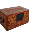 Close-up of red lacquer antique Chinese box with gold floral inlay, metal lock, and side handle.