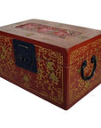 Close-up of red lacquer Chinese box with gold floral inlay, metal handles, and ornate clasp on decorated top panel.