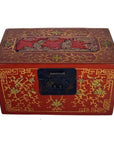 Red lacquer Chinese box with gold floral inlay, black clasp, and hand-carved lid scene, close-up view.