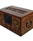 Black and gold lacquered Chinese box with gilt floral details, dancing figures on scenic lid, black handles, decorative lock.