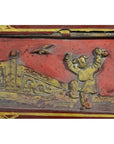 Close-up of red and gold lacquer box with ornate raised design, antique finish.