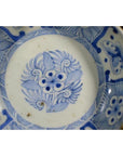 White porcelain bowl with butterfly cartouches, petal rim, and intricate decorative details, antique Chinese style.