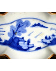 Blue and white porcelain cloud-form dish with Chinese landscape scene, river view, figural design.