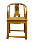 Dark wood Chinese horseshoe-back chair with rounded backrest and carved panel showing decorative figure, front view.