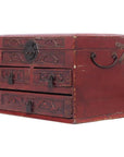 Dark red lacquered Chinese jewelry box with black metal locks and multi-drawer cabinet design, close-up view.