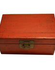 Black and red lacquered Chinese antique box with metal clasp, close-up against a plain white background.