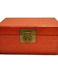 Black lacquered antique Chinese box with brass latch, closed, set against a plain white background.