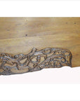 Light brown wood Chinese lacquered cabinet doors with swirling floral and leaf patterns, close-up view.
