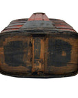Brown lacquered wood tiered food basket with metal bands and dark markings, handmade, shown on worn wood.