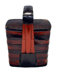 Black and red hand-painted lacquered wood tiered food basket with tall handle, rectangular shape, close-up view.