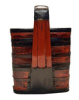Close-up of red and black lacquered Chinese wooden tiered food basket with hand-painted slats and tall single handle.