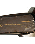 Black and red lacquered wood tiered food basket with worn paint and rust, handcrafted, shown indoors.