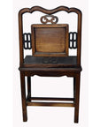 Brown lacquered yumu wood side chair with hand-carved décor and ornate backrest, antique style.