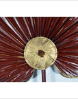 Close-up of maroon and gold antique Chinese fabric flags with pleats on a light background.