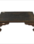 Dark wood antique Chinese Low Kang coffee table with worn surface and simple curved legs, front view.