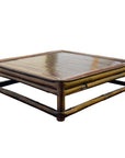 Brown wood antique Chinese low Kang square ceremonial prayer table against plain white background.