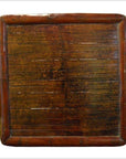 Brown wood and bamboo square ceremonial table with vintage finish, low height, shown indoors.