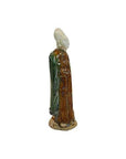 Green and brown terracotta Ming dynasty court figure statue wearing a tall hat, on white background.