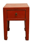 Red lacquered wood side table with one drawer, metal pull, and horsehoof-style legs, antique Chinese design.