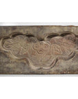 Gray stone Chinese rice mold with carved lotus flowers and leaves, rectangular shape, close-up.