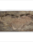 Gray stone Chinese rice mold with carved lotus flowers and leaves, rectangular shape, close-up.