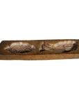 Brown wood antique Chinese rice mold with carved fish and seashell designs, close-up view on neutral background.