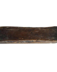 Close-up of a dark wooden antique Chinese rice mold with visible wear and scratches on a white background.