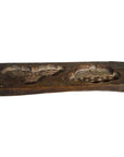 Brown wooden rectangular Chinese rice mold with two carved compartments, close-up view.